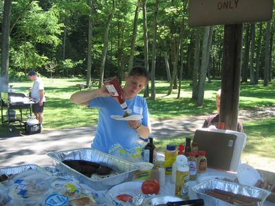 Reunion 2010
Ginger gingerly catsups burger.  Someone lurks behind the pole.
