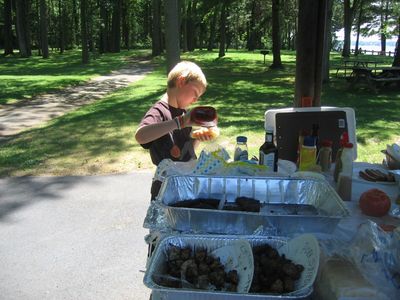 Reunion 2010
Justin (Entwistle) juggles dog and catsup.  Taste buds a poppin'!
