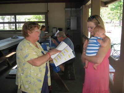 Reunion 2013 VBSP
Mary Smith Taglieri hands out badges to Rebecca Smith Tousant, holding Blake
