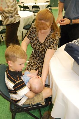 Sunday Party at OLS School
Guests: Sam Hughes holds Eli Glazer, mother Mary Higham Glazer looks on.
