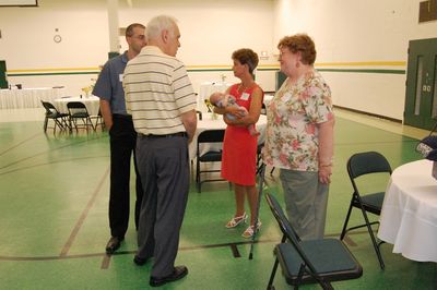 Sunday Party at OLS School
Guests: Art Glazer talks to Betty Sauerzopf.  Mark Glazer, Peg Higham, holding Eli Glazer
