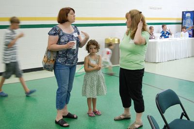 Sunday Party at OLS School
Guests: Lynelle Howey talks with Joan Higham Entwistle.  Silvi Howey looks on.
