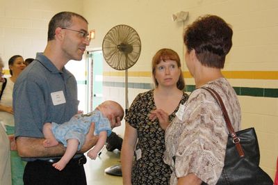 Sunday Party at OLS School
Guests: Mark (holding Eli), and Mary Higham Glazer greet Jo Jennings
