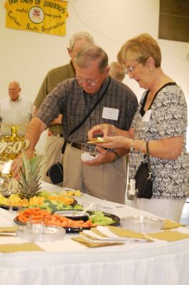 Sunday Party at OLS School
Guests: Stu and Marion Tillis check out the appetizers.  Fred Howey in the background.
