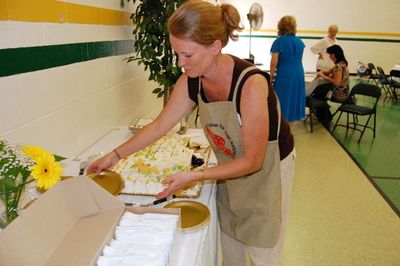 Sunday Party at OLS School
Cake:  Ann Hughes assists with serving the cake.
