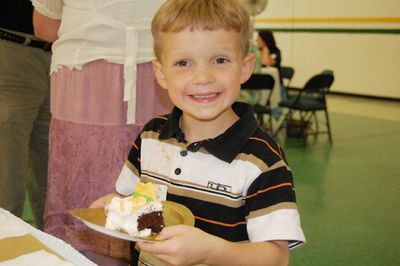 Sunday Party at OLS School
Cake: Sam Hughes is happy with his cake.
