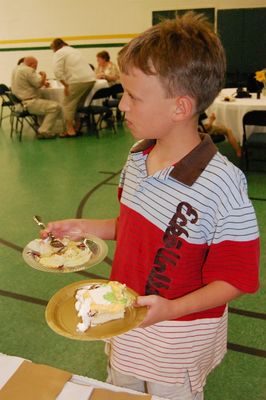 Sunday Party at OLS School
Cake: Joe Hughes assists with cake serving.
