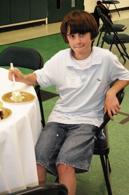 Sunday Party at OLS School
Cake: Tim Awad tastes his cake.  Good?
