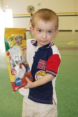 Sunday Party at OLS School
Games Gifts: Cole Entwistle shows his gift.
