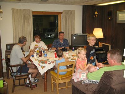 Friday/Saturday Breakfast and Picnic
Picnic: At table: Mark; Mary; Joe; Cole (back to camera) 
Madison and Justin watch John with Eli in the Rec Room
