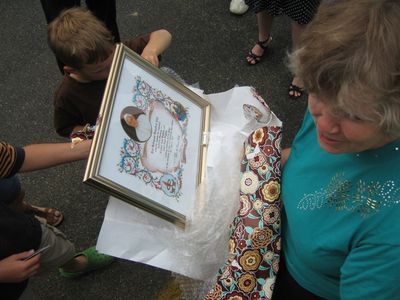 Saturday Church 7
Church 7:  Jan opens Papal Blessing from family
