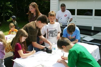 Friday/Saturday Breakfast and Picnic
Picnic: Arts and Crafts. T-Shirts.  Autographing T-Shirts for all children.
L to R: Madison Higham (off camera left); Riley Hughes (at rear); Julia, Nicholas, Rachel (in back); Joe Hughes; Laurel Higham; Thomas Higham (front); 
Ted Foley at the grill in back.
