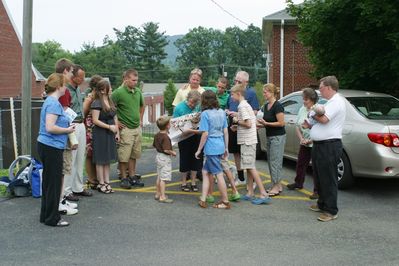 Saturday Church 1
Church 1: Gift opening: Mary Higham Glazer; Arik Foley; Ben Hughes; Peg and Katie Higham; Andy Foley; Sam Hughes; Jan, Jim, Laurel, David, and Jack Higham; Riley and Ann Hughes; Sue and Ted Foley (holding Eli Glazer)
