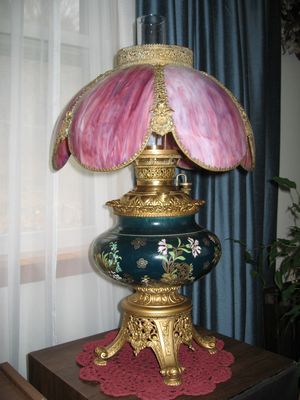 Higham Family
The Old Higham Lamp.
Originally an oil lamp, has been electrified.
Origin is uncertain.  It was in the house at 418 Floyd Ave., Rome, and appears in a photo of Joseph and Susanna sitting in a room at 418 Floyd.
Was in the possession of Dorothy Higham Rung, and passed on to Jack and Jan Higham.  It is now at their residence.
